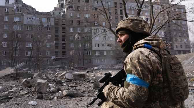 Ukrainian fighter in Mariupol/ AP photo